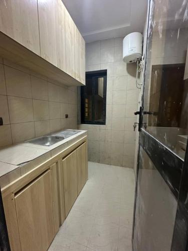a kitchen with a sink and a counter top at Warren appart in Lomé