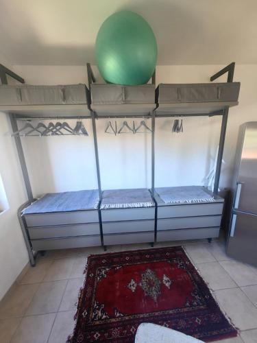 a room with two bunk beds with a green ball on top at Adriatic Lifestyle Apartment in Stari Grad