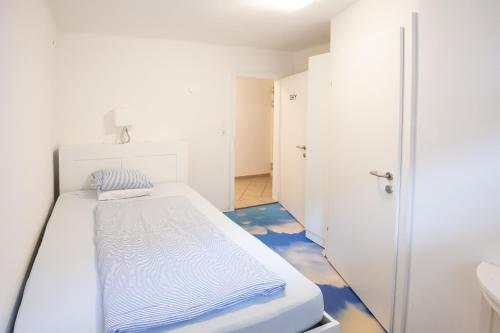 Ένα ή περισσότερα κρεβάτια σε δωμάτιο στο Guesthouse Fuschlsee