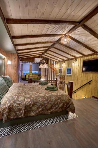 a bedroom with a large bed in a room at Scandinavian Rustic in Tríkala