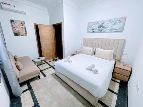 Un pat sau paturi într-o cameră la Hotel La Casa Blanca