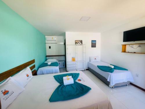 Postel nebo postele na pokoji v ubytování Ilha de Itacimirim Pousada & Suítes