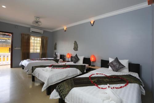 Postel nebo postele na pokoji v ubytování Cheng Lay Guesthouse