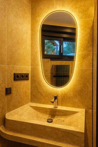 a bathroom with a sink and a mirror at Azulik Corsica in Corbara