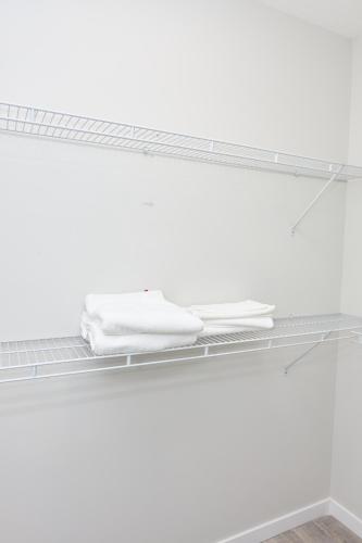 a shelf with a keyboard and a mouse on it at Anukc in Prince George