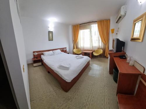 Televiisor ja/või meelelahutuskeskus majutusasutuses Traian Residence Constanța