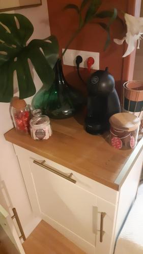 a wooden counter top with some items on it at Beautiful cocooning appartement in La Chapelle-sur-Erdre