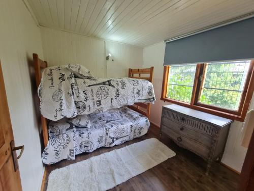 Voodi või voodid majutusasutuse Tu Casa familiar ideal, centrica en Lican Ray toas