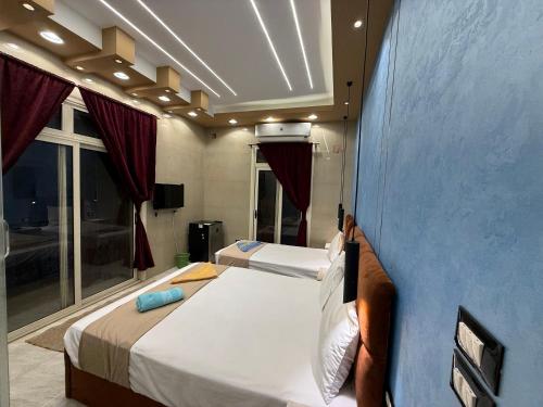 Ένα ή περισσότερα κρεβάτια σε δωμάτιο στο Cairo-Plaza, Halo Hotel