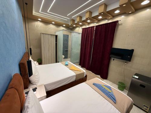 Ένα ή περισσότερα κρεβάτια σε δωμάτιο στο Cairo-Plaza, Halo Hotel