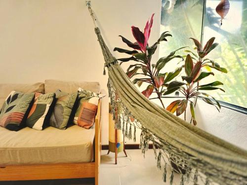 En eller flere senge i et værelse på Casa Pimenta - Apto aconchegante perto da rua do Mucugê