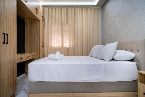 a bedroom with a large white bed with white pillows at Dar Belleza in Tangier