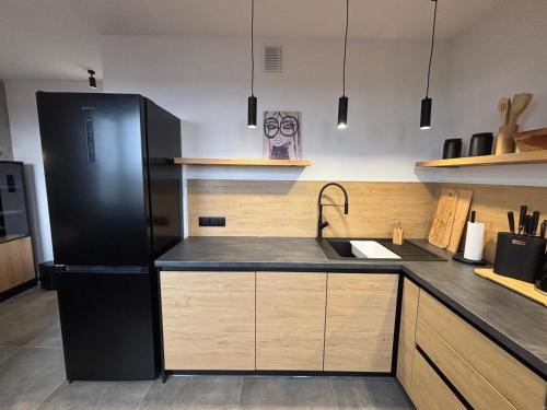 Η κουζίνα ή μικρή κουζίνα στο Loft Re Design Apartament