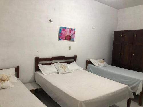 Ένα ή περισσότερα κρεβάτια σε δωμάτιο στο Recanto do Cajueiro - Luís Correia - Piauí