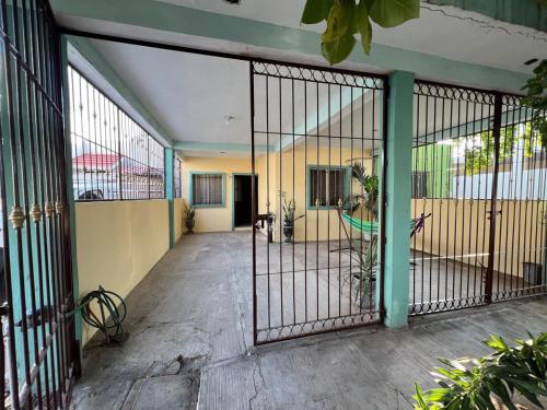an open gate of a building with a room at Casa en Manzanillo in Manzanillo