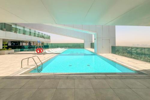 a large swimming pool on top of a building at Skyline 19 1 Residences in Dubai