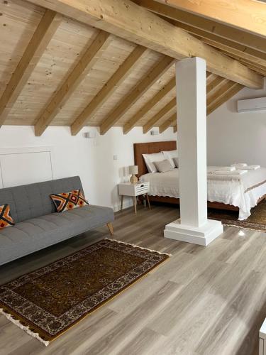 En eller flere senge i et værelse på Alojamento Infantes