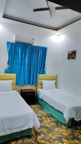 Postel nebo postele na pokoji v ubytování منتجع سيتي لاند