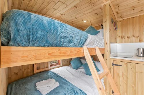 two bunk beds in a tiny house at Starry Nights Escape - Hot Tub & Sauna in Yarpole