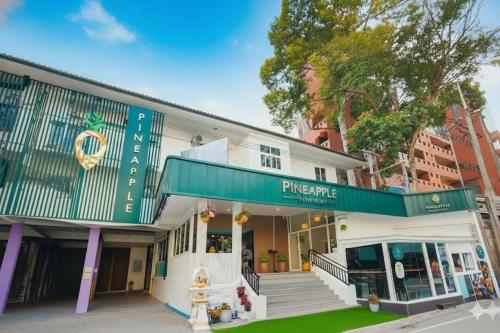 a building with a sign that reads pincepump at Pineapple Residence Pattaya in Pattaya