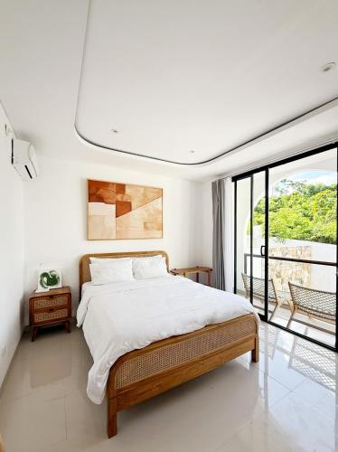 Ένα ή περισσότερα κρεβάτια σε δωμάτιο στο Villa Aura