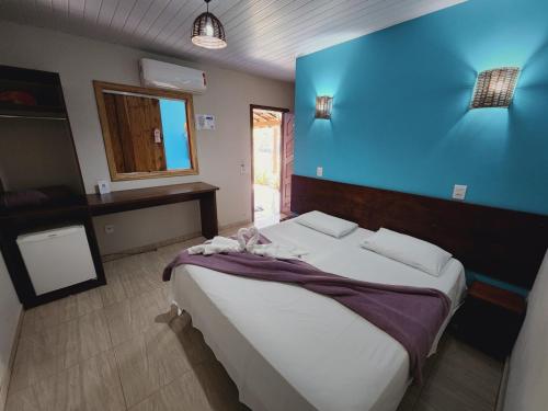 Un ou plusieurs lits dans un hébergement de l'établissement Pousada Bom Jardim