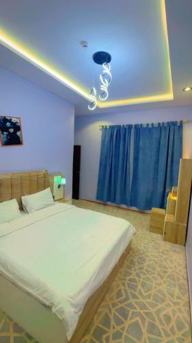 Postel nebo postele na pokoji v ubytování منتجع سيتي لاند 2