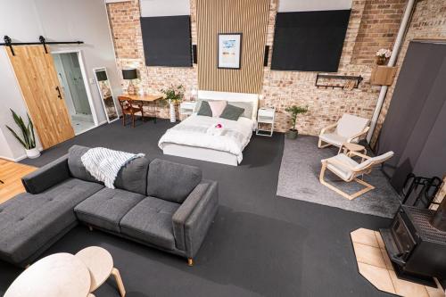 a living room with a couch and a table at Mirambeena Retreat in Toowoomba