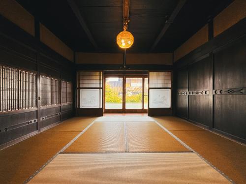a room with a hallway with a door and a window at #12 Sekigahara Hotaru in Sekigahara