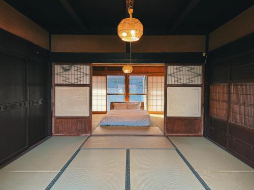 Postel nebo postele na pokoji v ubytování -関ヶ原 蛍-古民家の宿