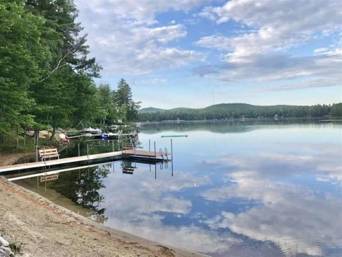 a view of a lake with a dock at BARKER POND ESCAPE LIMIT 8 villa in Hiram