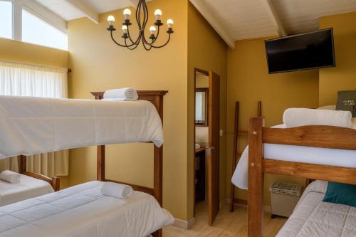 Ένα ή περισσότερα κρεβάτια σε δωμάτιο στο Hotel Aparts Cabañas Tierra de Glaciares