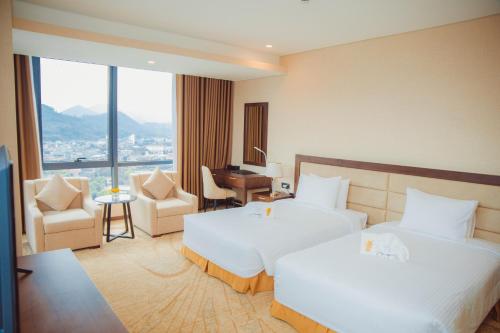 Giường trong phòng chung tại Muong Thanh Luxury Cao Bang