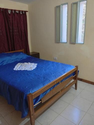 En eller flere senge i et værelse på Refugio Blue Hill I