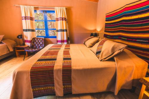 Postel nebo postele na pokoji v ubytování Ckoi Atacama Lodge