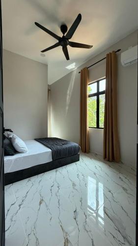 Postel nebo postele na pokoji v ubytování Rumah Singgah Jerteh