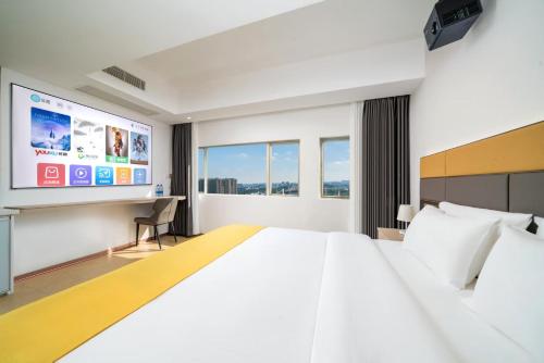 Giường trong phòng chung tại Yue Mei Elegant Hotel Apartment (Pazhou Exhibition Center)