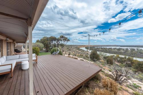 a house with a deck with a view of a river at River Murray Views in Nildottie