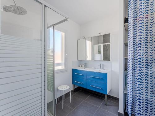 a bathroom with a blue sink and a shower at Maison spacieuse à Biscarrosse-Plage près de l'océan - FR-1-521-251 in Biscarrosse