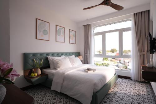 Giường trong phòng chung tại LE'S DALAT SKY Hotel Da Lat