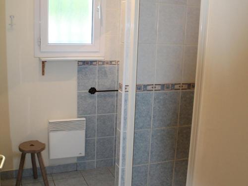 a shower with a glass door in a bathroom at Maison de plain-pied avec jardin clôturé, proche Thermes St Roch - 3 chambres, WiFi, cuisine équipée - FR-1-541-46 in La Roche-Posay