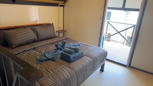 Ένα ή περισσότερα κρεβάτια σε δωμάτιο στο Lipe Baan Talay Homestay