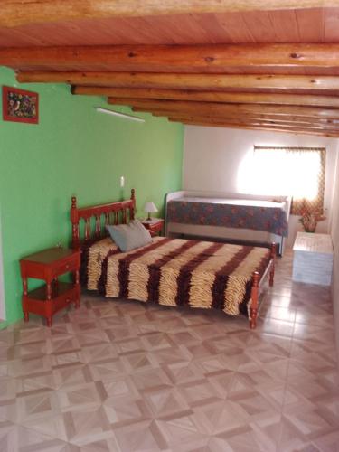 En eller flere senge i et værelse på Casa lo de norma