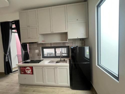 Η κουζίνα ή μικρή κουζίνα στο Tâm Dung Apartment