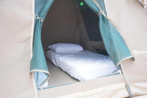 Ένα ή περισσότερα κρεβάτια σε δωμάτιο στο Oldonyo Musa Camp Amboseli