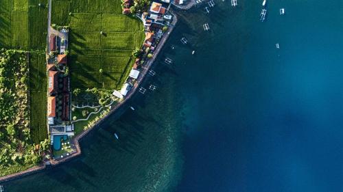 an overhead view of the ocean with boats in the water at Lovina Beach Club & Resort in Lovina