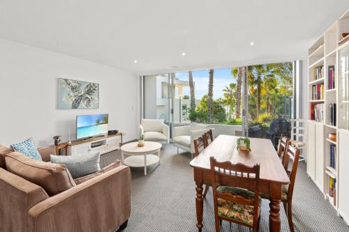 a living room with a couch and a table at Gorgeous 2-Bed Unit near Riverside Parks in Sydney