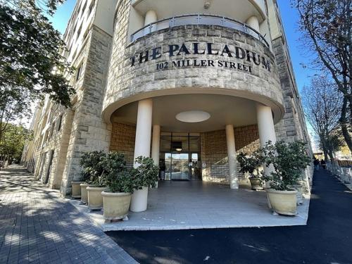 a building with a sign that reads the palladium no winter street at Poolside 2-Bed Haven, Walk to City Centre in Sydney