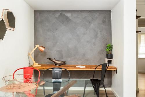 a home office with a desk and chairs at Suburban Two-bed Apartment with Parking and Patio in Sydney