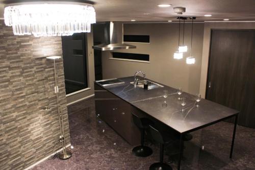 a kitchen with a sink and a counter top at 8Room - Vacation STAY 70870v in Yachimata